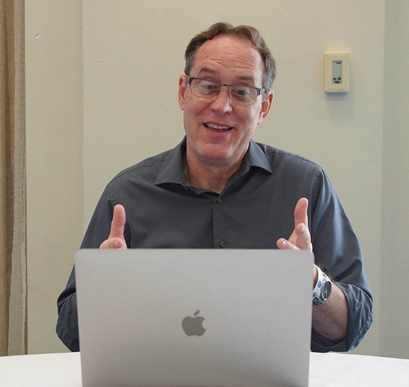 man talking to computer in virtual training